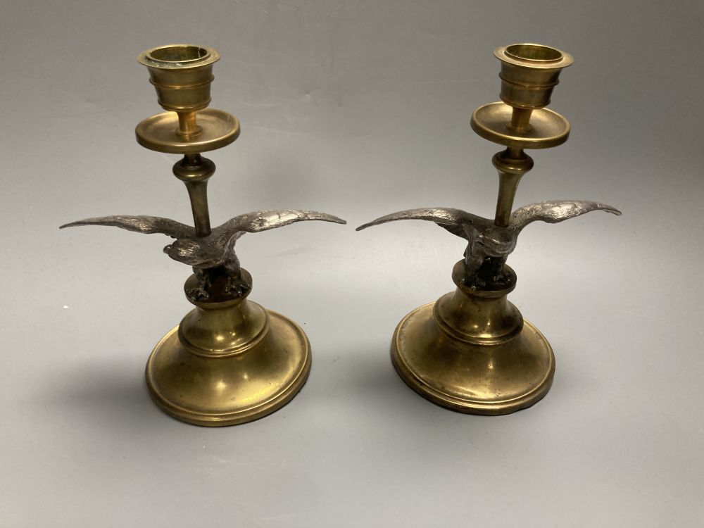 A pair of brass and spelter eagle candlesticks, height 19cm